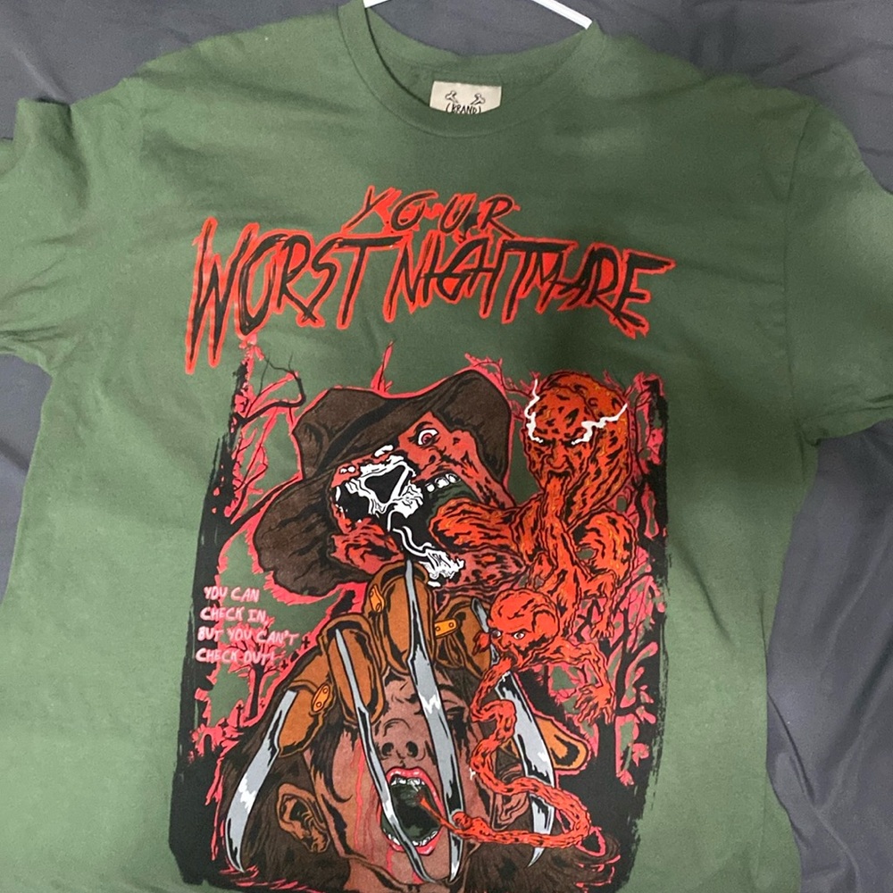 All star Eliot x Freddie Kruger on a dark green shirt.